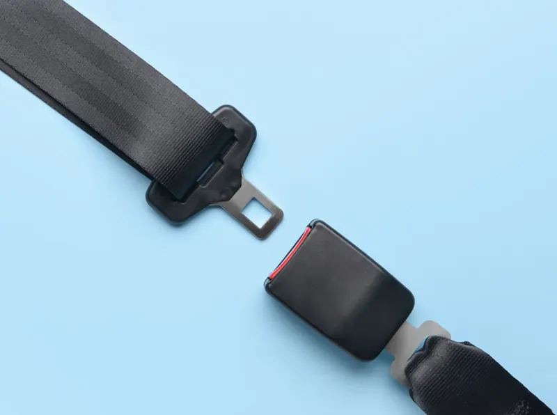 Seat belt assembly halves laid flat